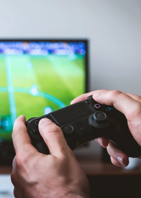 Image of hands holding a gaming console controller